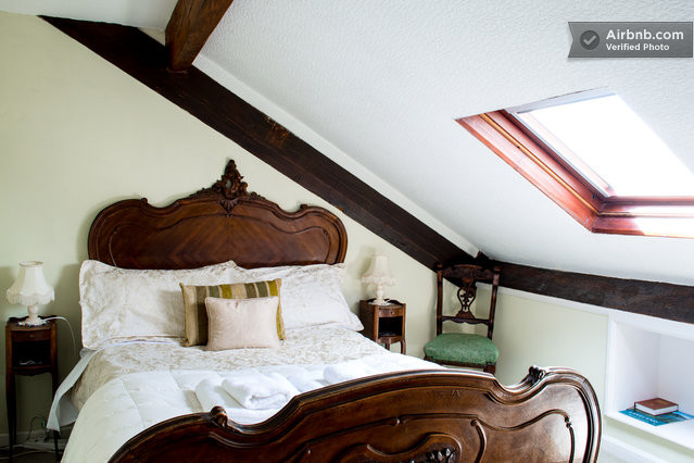 Enjoy your own special nest in this quirky attic room at Blenheim Lodge. From the velux window set in the slope of the ceiling may be seen far-reaching views of Lake Windermere and the mountains.